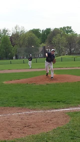 Freshman Emerson Egly delivers a pitch in a May 24 section game against Edison High School. there are small things we need to improve on but overall it was a good day for us, Egly said. 