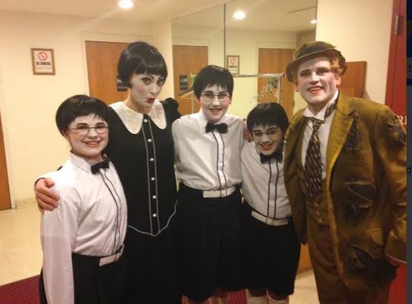 Sophomore Claire Walsh (far left) with other performers in the Minnesota Operas The Magic Flute. The production broke ticket sales records. We were sold out 90 or 95 percent of the time, Walsh said.