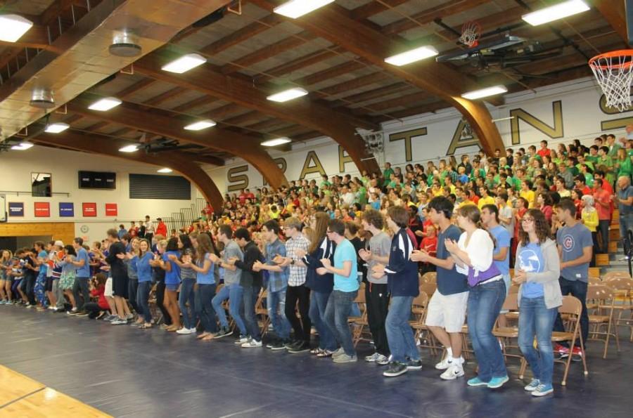 Students cheer loudly at the 2013 Homecoming Pepfest.  The annual event includes captains challenge, ping-pong finals, and the Spartan Beat.
