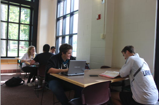 Upperclassmen work in the lunch room during Tutorial, now with laptops since the new WiFi was installed.  “It’s nice because it is a quiet space and I get to work on group projects and get it done with wifi,” senior Nancy Moyers (pictured above left) said.