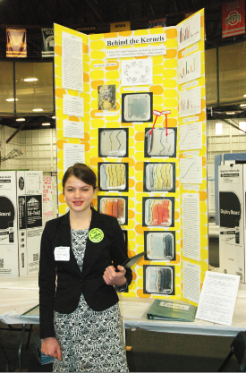 Freshman Emilia Topp-Johnson stands beside her project at the MASTERS. “Research is something I want to do for the rest of my life,” she said.