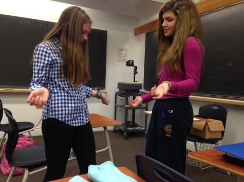 Sophomores Hana Martinez and Barbara Bathke discuss the dress code during free time at school. "We shouldn't base what we are allowed to wear on other people's reactions," Martinez said. 