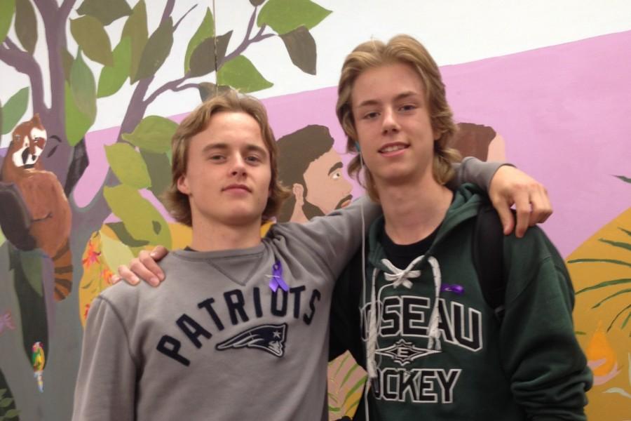 Juniors Justin Jallen and David Nicholson proudly display their purple ribbons in support of World Suicide Prevention Day. Many Upper School students and faculty have decided to wear the ribbons, which were created and dispersed by GSA.