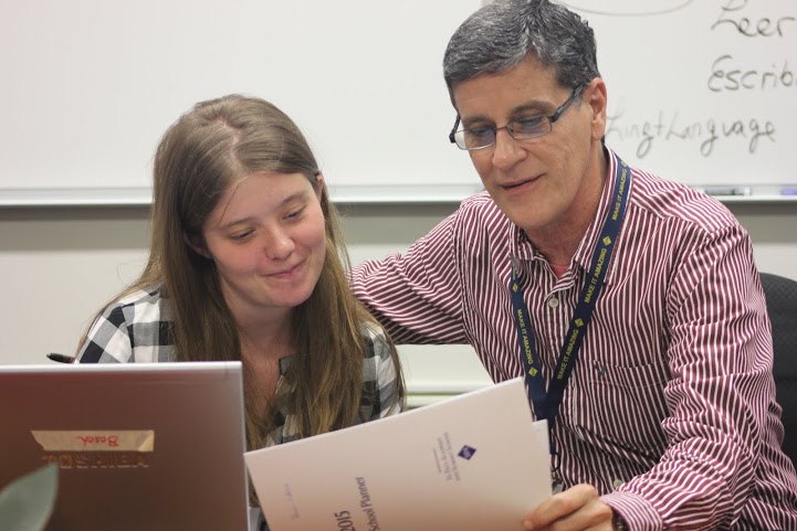 Estevéz looks over the documents for Level 3 Spanish, with teacher Ronaldo Castellanos. “I would love to learn lots of things about the different teaching [styles], because it’s very different, the way of teaching here [compared to the] way of teaching in Spain,” Estevéz said.