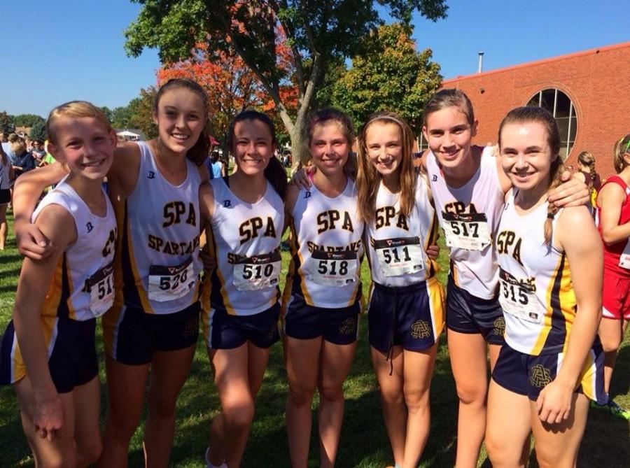 Members of the Girls Varsity pose for a group photo at the Eagle Invitational meet on Sept.20. The Spartans placed 9 out of 15 total teams.  “I’m really excited to see how well we run for the rest of the season,” sophomore Nora Kempainen said. 
