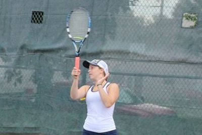 Junior tennis player Ella Hommeyer prepares to return the ball during practice. I know I’m lucky to still be playing because most tennis players are done at this point in the season so I’ll try to make the most of this opportunity,” Hommeyer said. 
