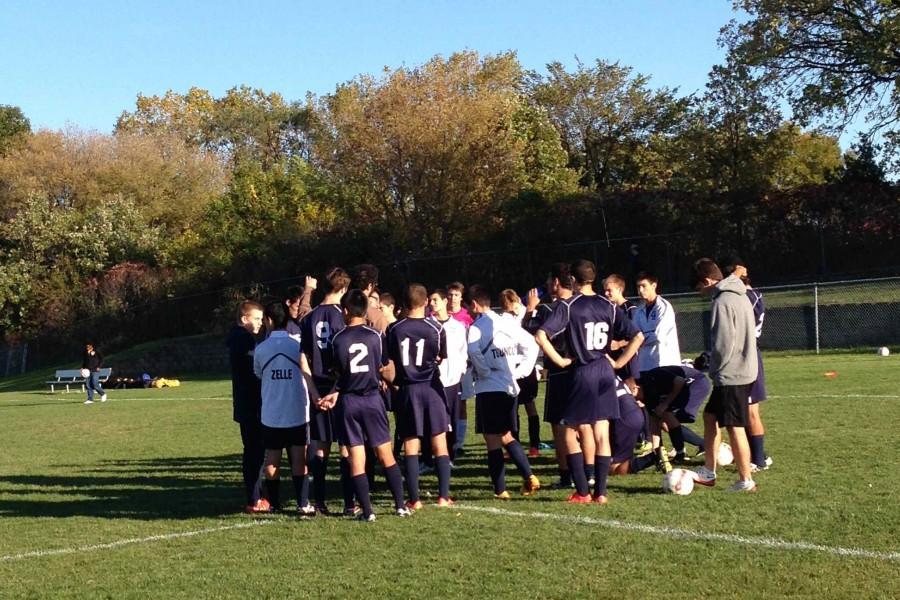 The team regroups at halftime in the game against Como Park. The Spartans lost 1-0. 