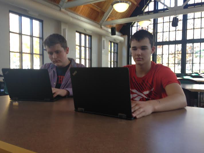 Freshmen Freddy Keillor and Oscar Millerhaller sit down to take their ImPACT baseline test in 

the Dining Hall on Oct. 23. “It’s good that we take this test and I’m glad they make us because it 

is more safe,” freshman Freddy Keillor said.