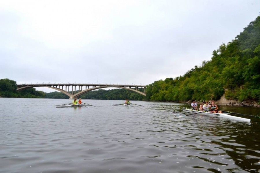 Senior Samantha Linn practices with her team (in boat on left, orange jacket) on the Mississippi River this summer.  “I encourage everyone to try it. You will be in the best shape of your life and you can meet new people that you would never meet otherwise, “ Linn said.  Interested students can check out Minnesota Boat Club, Twin Cities Youth Rowing, or Minneapolis Rowing Club.