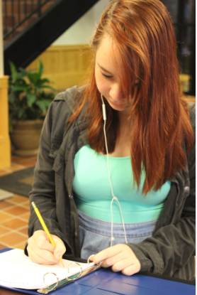 Sophomore isabelle Bukovsan signs in to the building in Davern Commons.  Students who arrive at school before 7:30 or who stay after hours and on weekends must utilize the sign-in sheet.