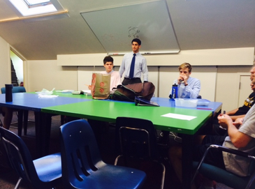 Sports Forum meets during x-period on Oct. 9. “We bring in a variety of different topics from that week in sports and vote on what we want to discuss as a group, and also do different polls and interactive activities,” senior Co-President Isaac Forsgren said.