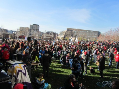 Protesters gather in front of the TCF Bank Stadium in opposition of the Washington Redskins' mascot.