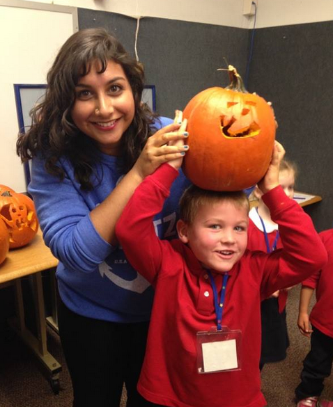 Senior Afsar Sandozi poses with her partner and pumpkin. 