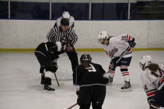 Junior Bridget Hoffmann faces off for the puck in the team's Nov. 29 victory over the Minneapolis Novas.
