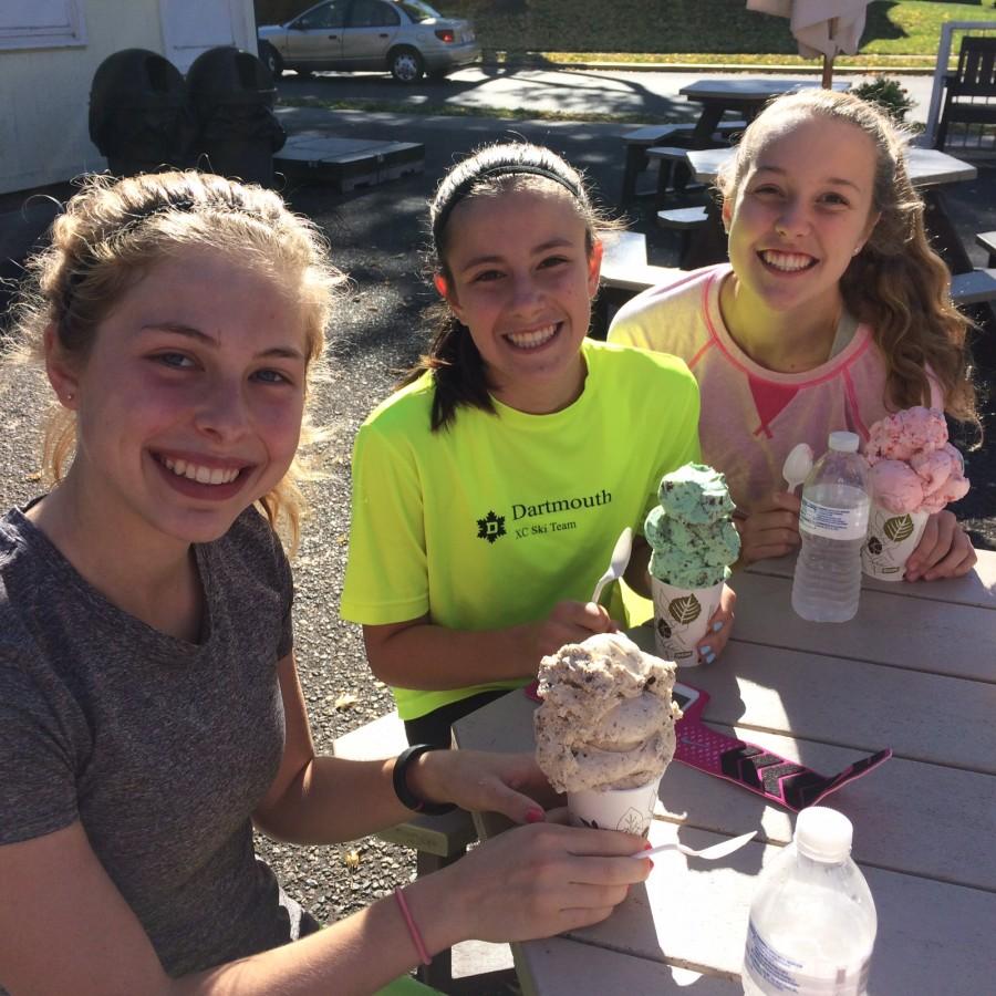 Cross country runners senior Mary Naas, freshman Val Hart, and freshman Greta Sirek enjoy a delicious ice cream treat from Nelsons Ice Cream.