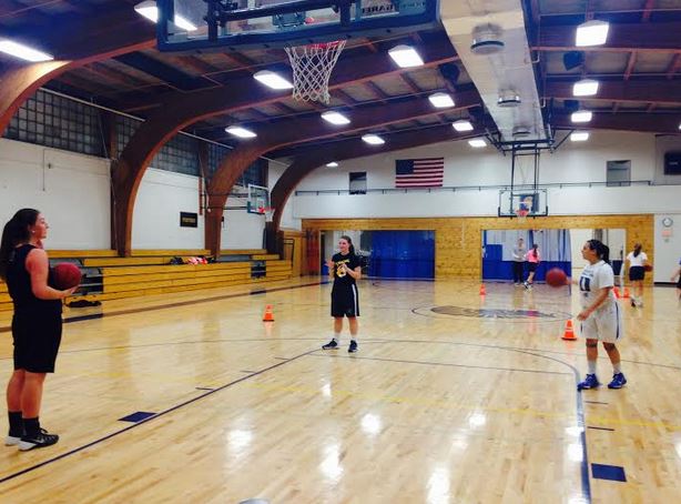 The girls basketball team  works on shooting during captains practice on Nov 11.  I think the team goal is just to get our groove and stick with it,” sophomore Lea Moore said. 
