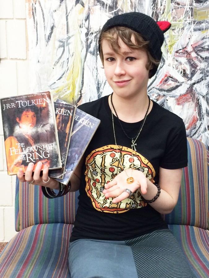 Junior Alice Tibbetts holds up some of her much-loved Hobbit merchandise. “I’ve come to appreciate some of the characters more because of how well they are acted, especially Gandalf and Bilbo,” she said.