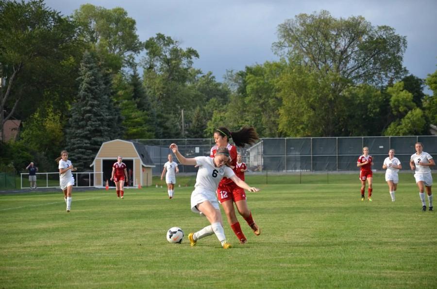 Sophomore Lauren Hansen play soccer in a game against Visitation. “After school I either go to dry-land for Alpine or we go to Buck Hill, I get home at, like, seven. I go to soccer until ten, then I go home, do my homework, shower, and sleep,” Hansen said. 