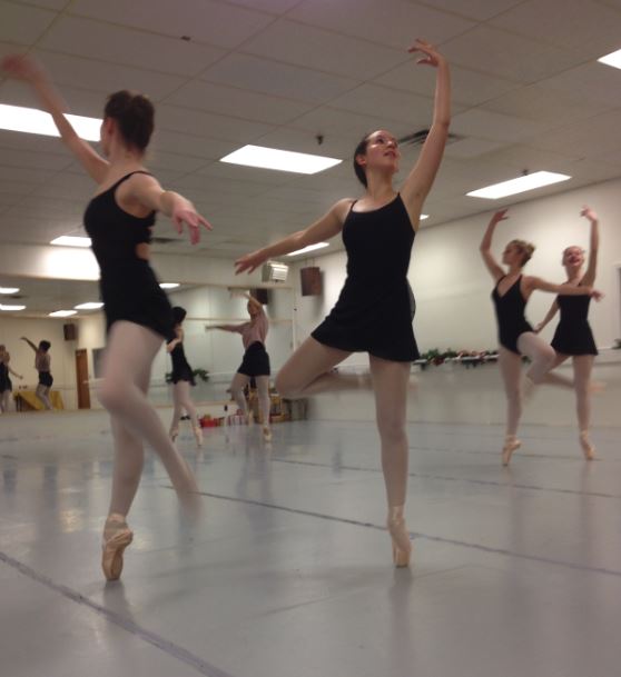 JUnior nina zietlow rehearses the flower corps dance for Clara’s Dream. “It takes a lot of work because [in the picture] the part I’m doing you have to do with your partner, and to stay together and be in sync while still being expressive with the movement is hard,” Zietlow said. 