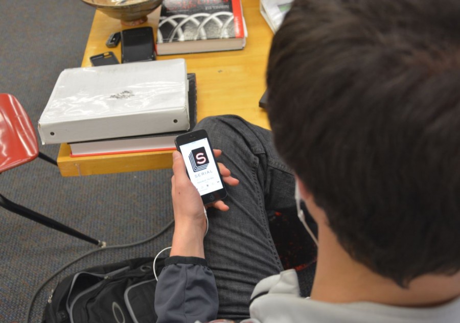 A student listens to Serial on his iPhone. As said best in the description of the show on iTunes, “Serial unfolds one story – a true story – over the course of a whole season.”