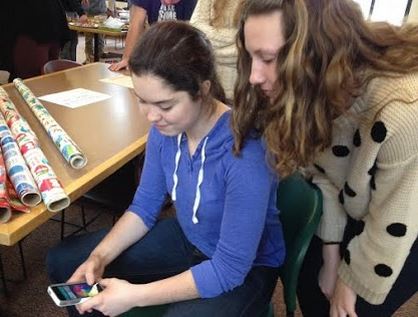 Juniors Alena Porter and Hallie Sogin play a round of Trivia Crack before advisory. “People got me started on it, and now I can’t stop,” Sogin said. The game is ranked #1 in the Apple Store and #4 on Google Play. 