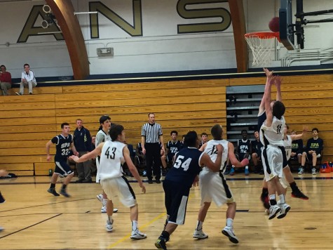 Players reach for the rebound during the SPA vs. Providence game. The Spartans won 72-48 and will be playing Breck on Jan. 9 at Breck.