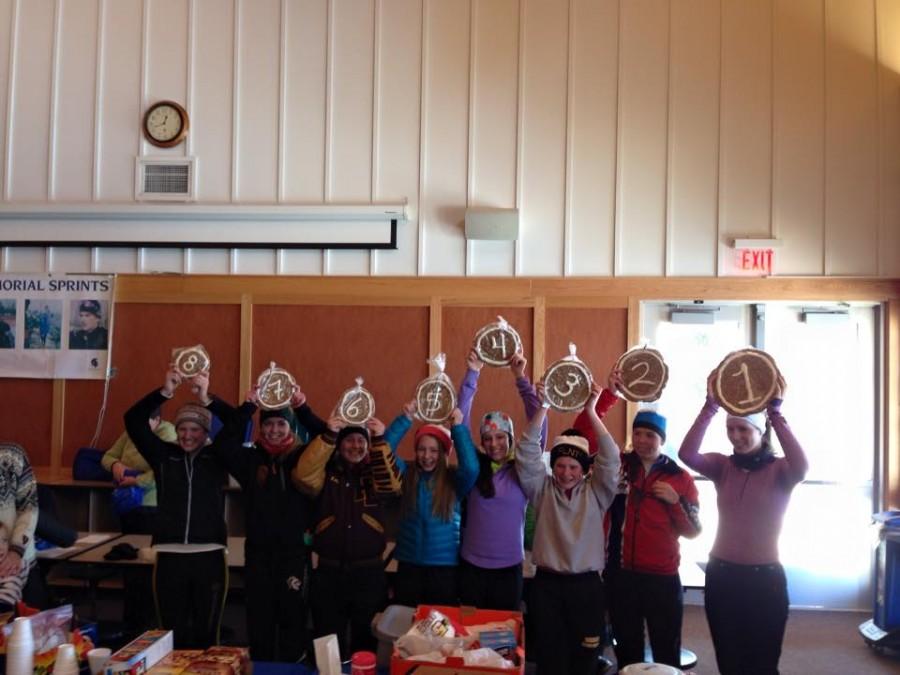 The first eight finishers of the 11th Annual Peter Westra Memorial Sprints pose with their cookie prizes, including first place Spartan finisher ski captain Ellen McCarthy and fourth place finisher freshman Val Hart.  “I wasn’t expecting to win anything, so it was really motivating to get fourth place, Hart said.