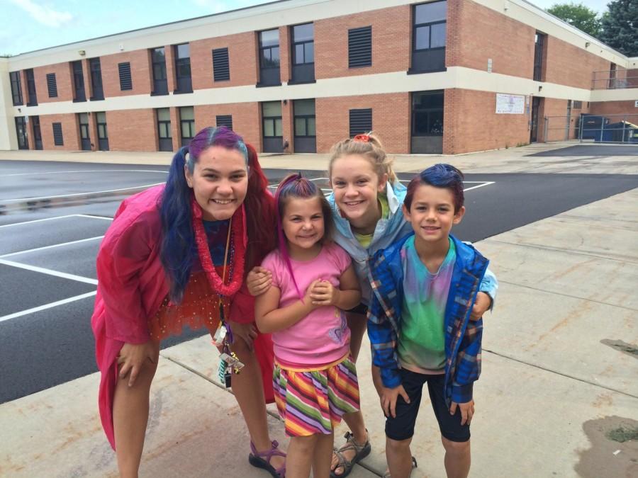 Sophomore+Katie+Brunell+%28right%29+with+another+counselor+and+two+campers+on+Crazy+Hair+Day.