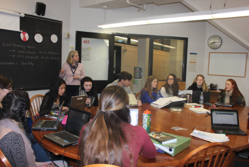 Upper School History Teacher Nan Dreher teaches her senior spring elective, Women of History in the World on Jan. 29.  “There are a lot of voices that don’t get heard in history...[this course] is a start,” senior Mattie Daub said.