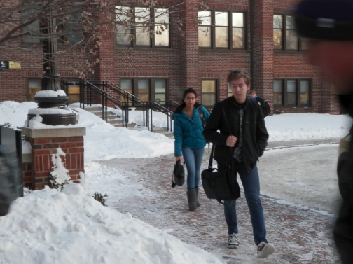 Sophomore Meley Akpa and freshman Duke Nguyen walk into school in December on one of the coldest days of the year. “The walk into school, even though it’s short, is still really cold,” Akpa said.