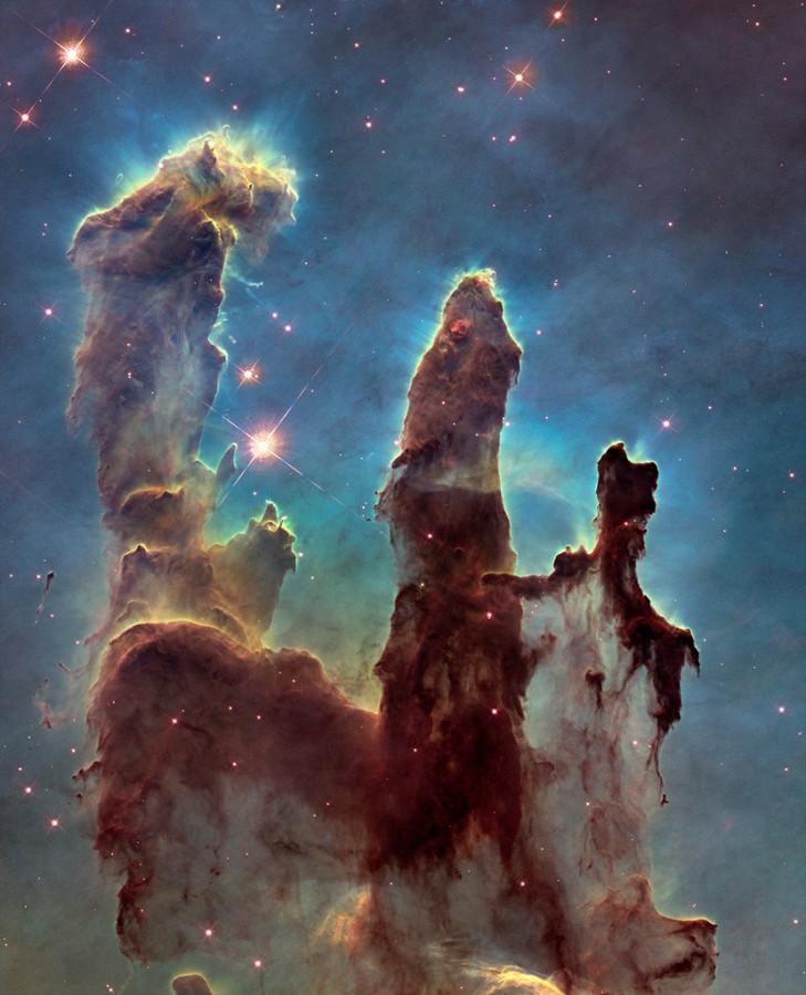 The an image of the iconic Pillars of Creation taken by the Hubble Space Telescope.