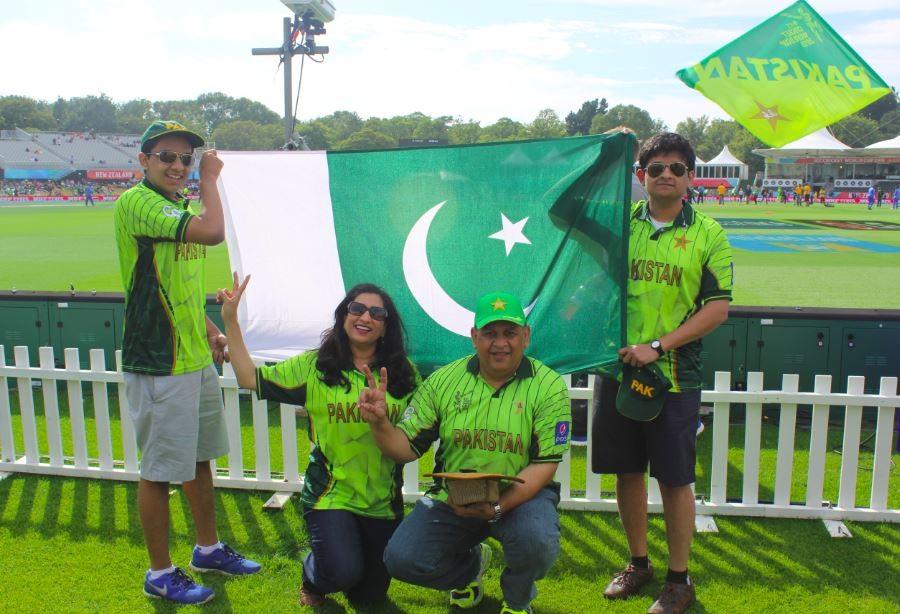 Freshman Adnan Askari holds the Pakistani flag in front of the Hagley Oral in Christchurch New Zealandfor the Pakistan and West Indies Cricket World Cup Math with the rest of his family. I got to see cricketers that Ive looked up to for essentially my entire life ... [it] made for an experience that Ill never forget, Askari said 