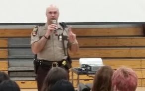Minnesota Department of Public Safety officer Curt Thurmes engages students in conversation about crashes. "The images you saw in this film were not accidents. They were crashes. 100% preventable," he said.