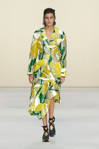 Sports shoes are paired with a dress on Marni's runway, in accordance with the sports luxe trend.