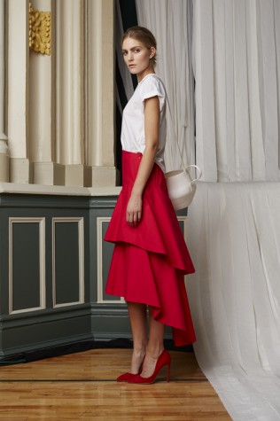 This Rosie Assoulin skirt is reminiscent of a flamenco dress, in the trendy color of bright red.