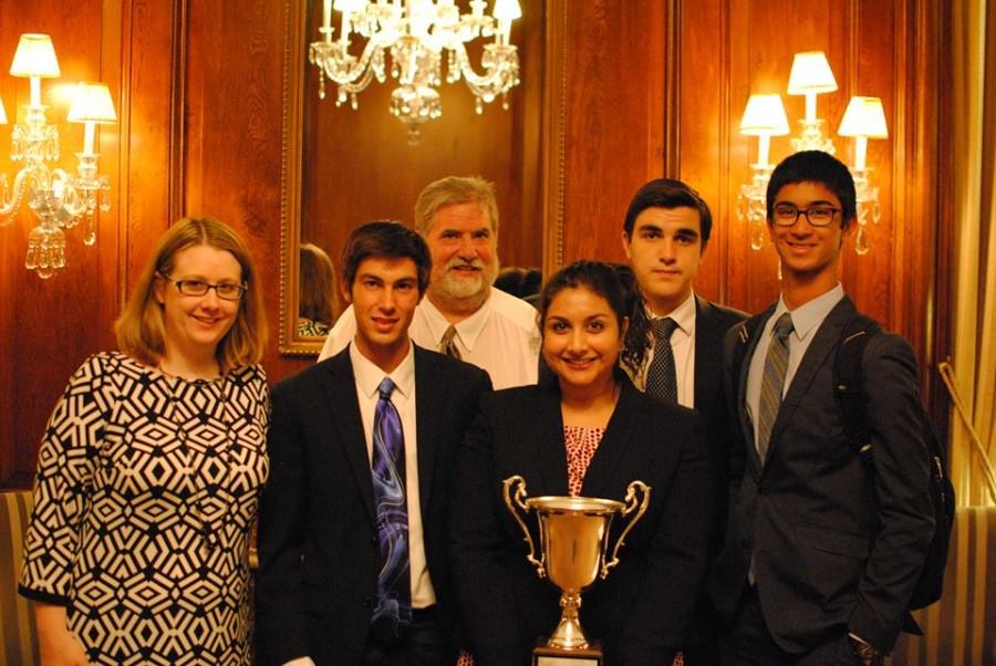 Seniors Jordan Hughes, Afsar Sandozi, Thomas Toghramadjian, and Shaan Bijwadia, along with their coaches, Heather Fairbanks and Tom Fones hold up their second place trophy. “We had an amazing time. It was funny to see as we exceeded everyone else’s expectations as well as our own,” Sandozi said.
