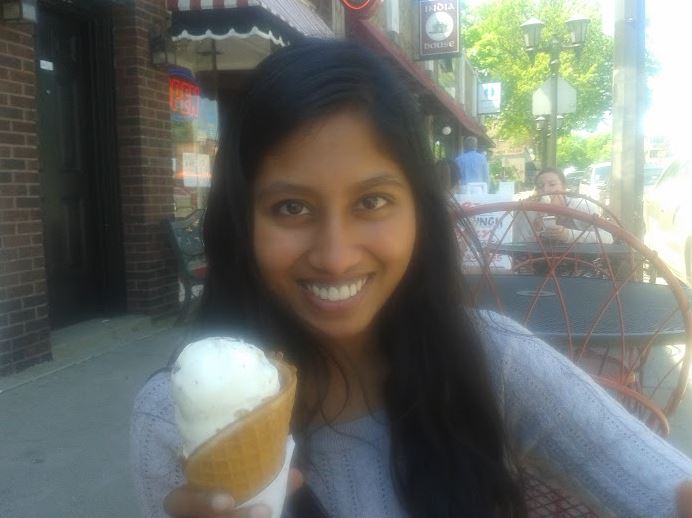 Junior Navodhya Samarakoon holds an ice cream cone on a sunny afternoon while enjoying junior privileges.  Samarakoon and junior Maya Smith went out to lunch at Punch Pizza, then stopped at Grand Ole Creamery for ice cream. “It felt like we were skipping school,” Samarakoon said. “It was nice to de-stress ourselves by eating ice cream and good food that we both enjoy, and just talking to each other,” Samarakoon said. 