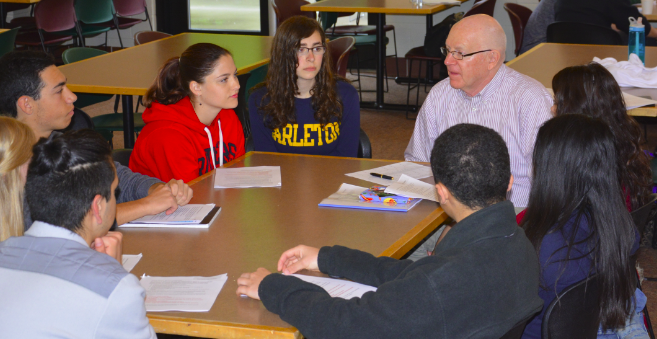 Seniors meet with faculty during senior project breakfast. For his senior project Dean Issacson worked with his soccer coach,