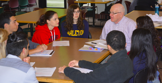 Seniors meet with faculty during senior project breakfast. For his senior project Dean Issacson worked with his soccer coach, this internship might lead to a job opportunity somewhere down the road, Issacson said. 