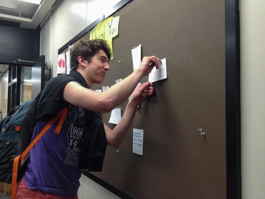 Junior Milo Wittenberg pins his thank you note on the Thank You Board. “I think it’s important to have a forum in which to express one’s gratitude because that so often goes unacknowledged in this community,” Wittenberg said.