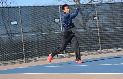 Senior Eliot Tong slams a ball across the net at a match against The Blake School on April 22. “ Blake is a very tough opponent, but it is fun to play them,” Tong said. The tennis team has an upcoming match on May 5, at home against Minnehaha Academy at 4 pm. 