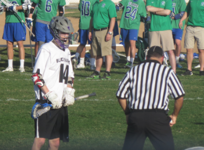 Junior David Nicholson prepares for the face off at the April 17 game against Blake. “[Creating a team] was a step in the right direction for the schools,” Nicholson said. 