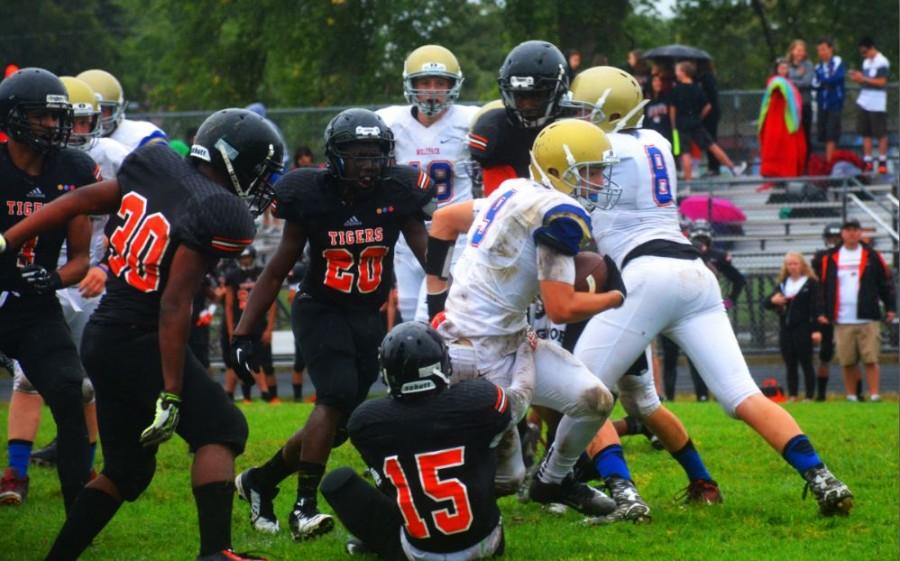 SPA senior Michael O'Shea (RB) rushes through the South defense.