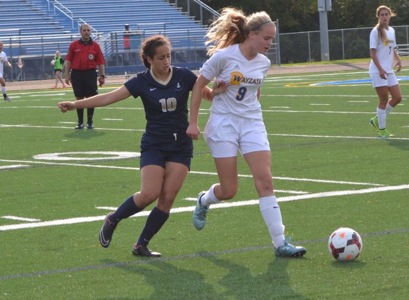 SOPHOMORE DINA MORADIAN FIGHTS for the ball during their match against Wayzeta on Aug. 27. “We’ve not gotten the results we’ve wanted now but sections are what counts. Don’t underestimate us based on our record,” junior Ella Matticks said.