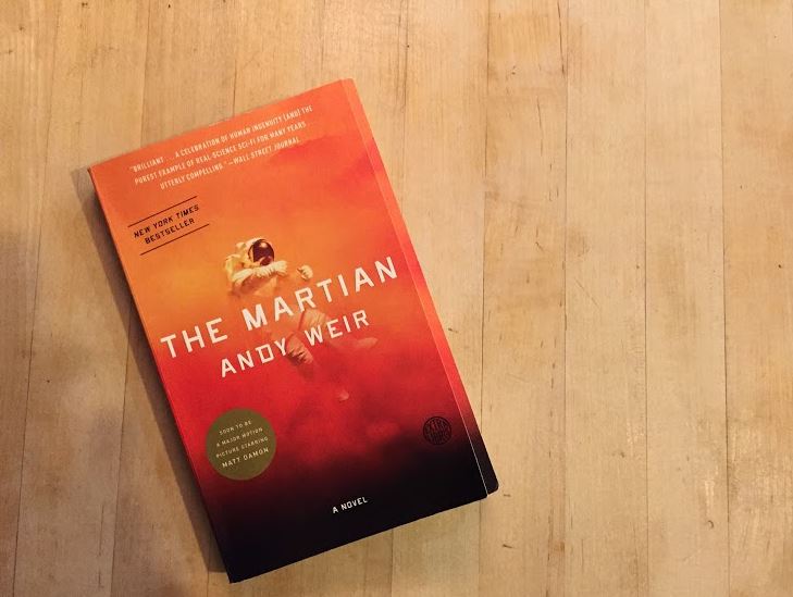 The cover of Andy Weir's The Martian.             The story revolves around the main character Mark Watney, a botanist, mechanical engineer, and the lowest ranking member of the Ares 3, the third mission to Mars. "The story itself is gripping. It will keep you on your edge of your seat," junior Lauren Boettcher said. 