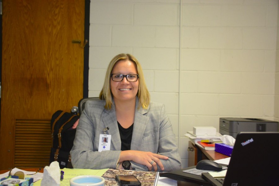 Dawn Wickstrum sits at her new desk at SPA. I want people to learn life lessons from the athletics at our school, Wickstrum said. 