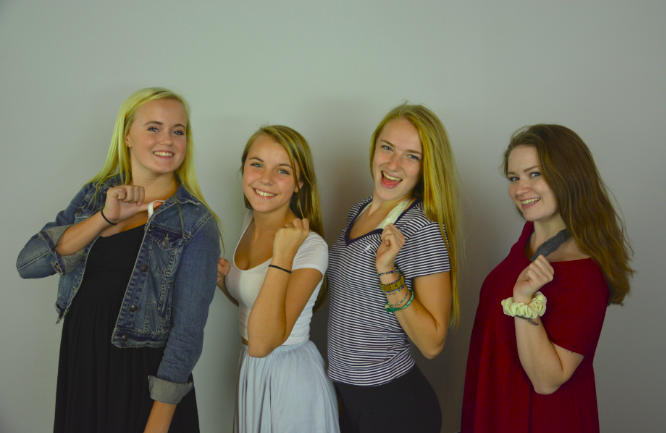 From left to right: sophomores Ashley Jallen and Sophia Rose, and seniors Lexi Hilton and Sabrina Brown model the new dress code. "I like how we have more freedom to wear what we want," Rose said.