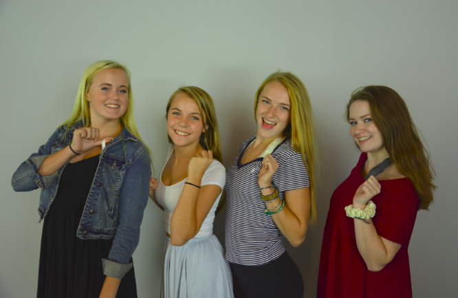 From left to right: sophomores Ashley Jallen and Sophia Rose, and seniors Lexi Hilton and Sabrina Brown model the new dress code. I like how we have more freedom to wear what we want, Rose said.