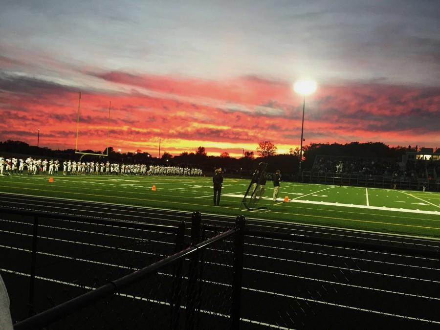 The+Wolfpack+line+up+for+the+signing+of+the+national+anthem%2C+a+tradition+for+ten+year+old+Providence+Academy+to+have+their+choir+sing+the+song+on+their+homecoming.+The+Wolfpack+won+the+game+39-20+to+complete+a+perfect+8-0+regular+season.