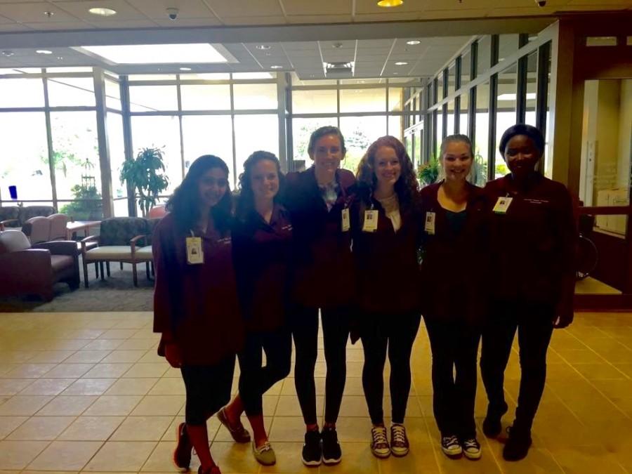 Junior Macy Blanchard stands with her volunteer group at Fairview Ridges Hospital. “I’ve met some really cool people [volunteering], which is very fun for me,” Blanchard said.